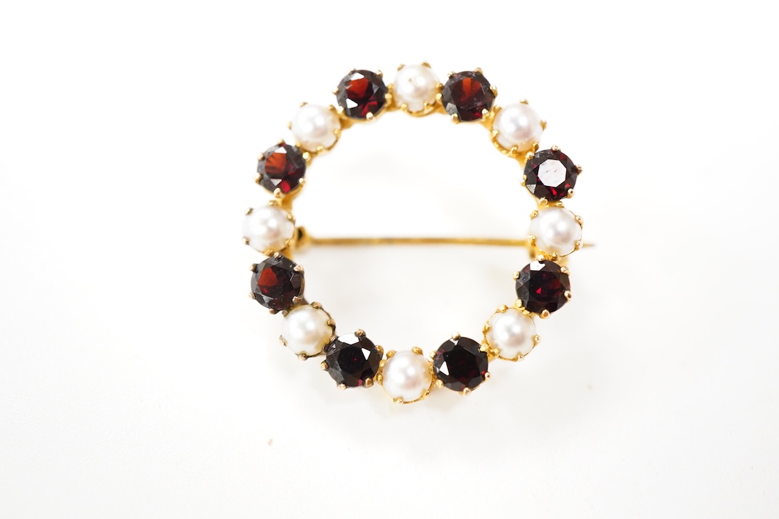 A Victorian 15ct and diamond set navette shaped Etruscan style brooch (lacking pin), 46mm, gross weight 3.5 grams, a 9ct, amethyst and seed pearl set bar brooch and a 9ct, garnet and split pearl set wreath brooch, gross